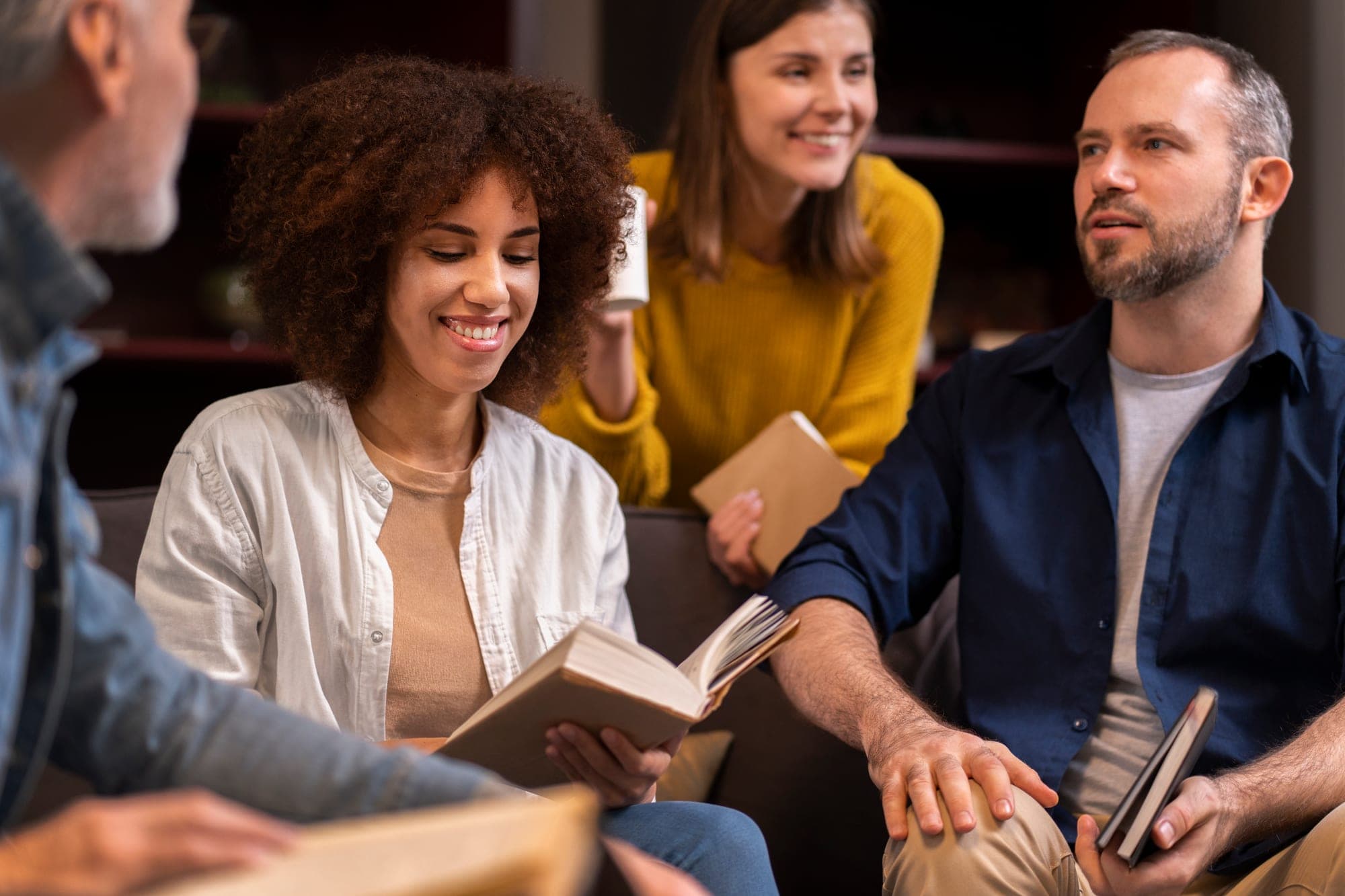 People reading their Bibles together at a camp session