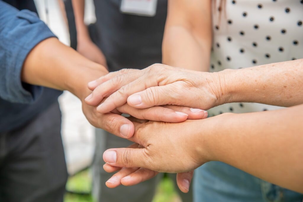 team unity to success with stack of hands,group people hands were collaboration to trust in business success concept of teamwork partnership